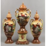 Edwardian pottery three part garniture of country house proportions, blush ground and decorated with