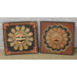 Two decorative wood and plaster wall plaques depicting Hindu sun gods.