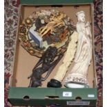 A box of oriental decorative items including hardwood carvings etc.