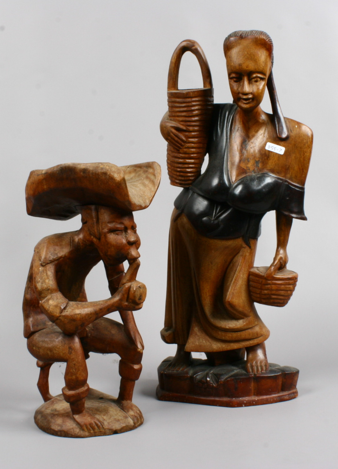 Two decorative carved wooden figures.