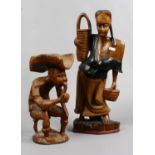 Two decorative carved wooden figures.
