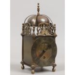 A brass cased Smiths 7 jewel lantern clock made in England.