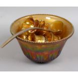 An amber carnival glass punch bowl set decorated with grapes and leaves.