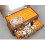 An oak jewellery box and contents to include modern silver earrings and bangles etc.