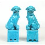 A pair of early 20th century Chinese porcelain mantel statues glazed in turquoise. Formed as a