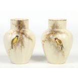 A pair of Grainger & Co. Royal Worcester China Works fluted high shouldered vases. Ivory ground