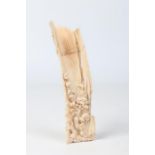 A Japanese Meiji period carved ivory okimono. Formed as a fragment of gnarled bamboo trunk, carved