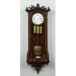 A 19th century walnut cased eight day triple weight Vienna wall clock by Gustav Becker. With