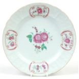 An early 19th century Chinese famille rose plate. With a relief moulded border interspersed with