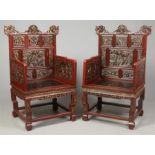 A pair of 19th century Chinese carved and lacquered hardwood armchairs / thrones. The backrests