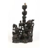 A large Chinese early 20th century carved hardwood table lamp base. Formed as a lion dog family,