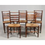 Five 19th century ash and elm ladderback rush seat kitchen chairs with turned cresting rails and