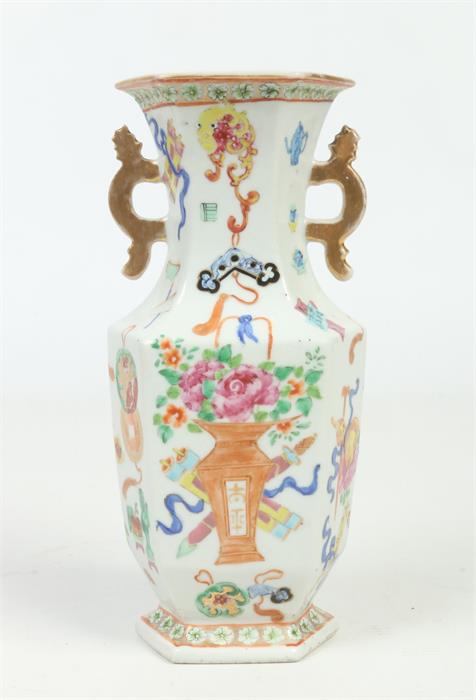 A 19th century Chinese hexagonal baluster twin handled vase. Painted in coloured enamels with