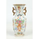 A 19th century Chinese hexagonal baluster twin handled vase. Painted in coloured enamels with