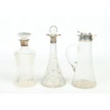Three silver mounted glass decanters. One of waisted form and having mushroom stopper assayed