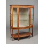 A Victorian satinwood bowfront china display cabinet raised on square tapering supports, 135cm high,