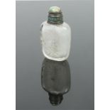 A late 19th century Chinese rock crystal snuff bottle carved in relief with lotus leaves. With
