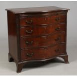 A George V Chippendale style mahogany serpentine chest of four drawers. Fitted for cutlery, with