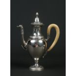 An Italian white metal pedestal coffee pot with carved horn handle. The spout of scrolling form is