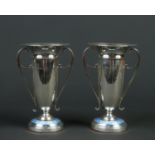 A pair of George V silver mantel vases by Patterson & Sons Ltd. Each with twin scrolling handles and