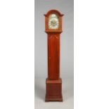 A George V mahogany cased eight day Grandmother clock. With brass arch top dial, quarter and