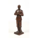 A Chinese Republic period carved hardwood figure of a man stood on a square plinth, 26cm high.