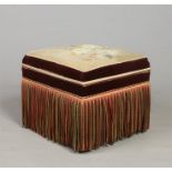 A Victorian ottoman, upholstered in velvet, with tapestry seat and fringed sides, 50cm high.