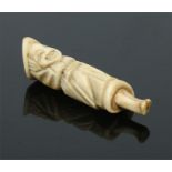 A Japanese Meiji period carved antler netsuke. Modelled in the form of a standing Dutch clergyman,