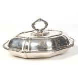 A Victorian silver plated entree dish and cover of scalloped lozenge form. With beaded rims and