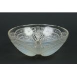 A Lalique opaline glass bowl decorated in the coquilles pattern with overlapping shells. Signed R.