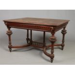 A 19th century Flemish oak centre table. With parquetry inlaid top, ornamented with masks to each