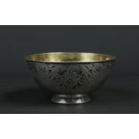 A Russian silver bowl. With gilt interior and having engraved and niello inlaid lambrequin border to