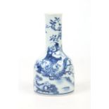 A Chinese blue and white mallet shaped vase. Painted in underglaze blue with a figure stood beside a