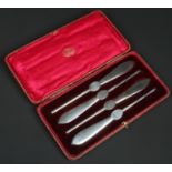 A cased set of four silver lobster picks / forks by the Goldsmiths & Silversmiths Co. Ltd. Assayed