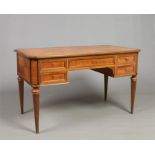 A French early 20th century kingwood kneehole desk. Quarter veneered, with gilt metal mounts and