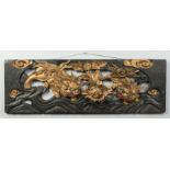 A pair of Chinese carved, pierced and lacquered wood panels. Each depicting a pair of lion dogs with