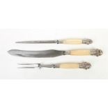 A Victorian three piece carving set marked for Scotia, Sheffield. With reeded ivory handles and