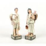 A pair of 19th century Continental faience figures. Modelled as a middle eastern boy and girl. The