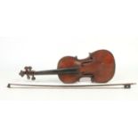 A 19th century violin and bow in case. No makers marks to either, 35.25cm.