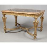 A large Victorian carved giltwood centre table with Italian marble inset top of oval form. Raised on