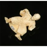 A Japanese Meiji period carved ivory figure. Formed as a drumming man wearing a kimono with