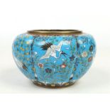 An early 20th century Japanese cloisonne lobed planter. Blue ground and decorated with cranes in