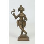 A 17th / 18th century Indian bronze figure of a deity holding a bird and a lotus flower, raised on a