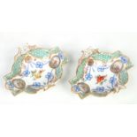 A pair of 20th century Continental Meissen style dishes. Gilded and painted in coloured enamels with