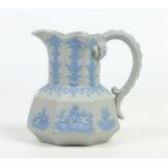 An early 19th century grey stoneware hydra jug. With applied blue sprigged mouldings formed as
