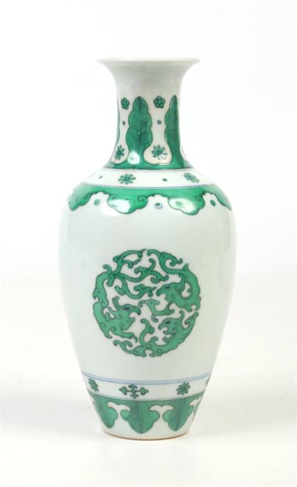 A small Chinese baluster shaped vase. Outlined in underglaze blue and painted in green enamel with - Image 3 of 4