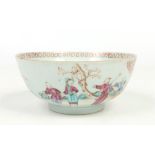 An 18th century Chinese bowl. Painted in coloured enamels with Mandarin figures in two landscapes