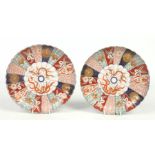 A pair of Japanese Meiji period Imari dishes of fluted form and decorated in brocade patterns with