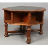 A Gothic revival oak library table of octagonal form. With leather top, carved gadroonoed edge,