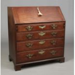 A George III mahogany bureau. With fitted interior, oak drawer linings and original brightwork,